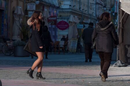 TIMISOARA, ROMANIA - NOVEMBER 29, 2016: Woman walking on the street. Rear view. Real people.のeditorial素材