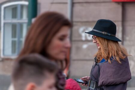 TIMISOARA, ROMANIA - FEBRUARY 09, 2016: Close-up of a woman walking on the street. Real people.のeditorial素材