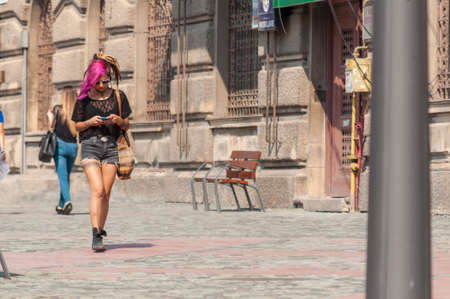 TIMISOARA, ROMANIA - SEPTEMBER 16, 2016: Woman walking on the street. Real people.のeditorial素材