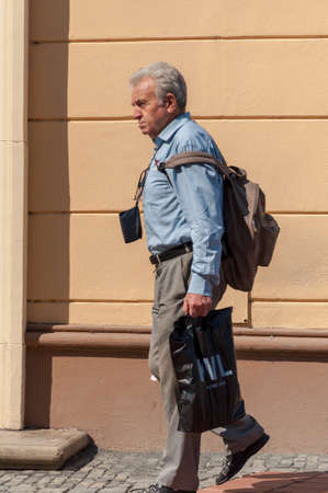TIMISOARA, ROMANIA - SEPTEMBER 09, 2016: Man walking on the street. Real people.のeditorial素材