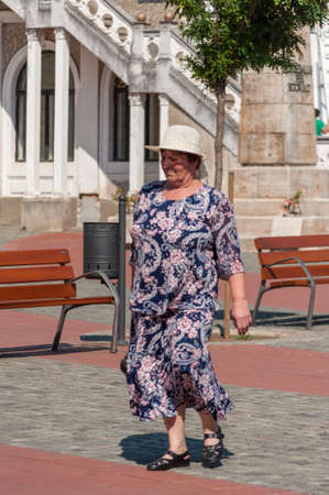 TIMISOARA, ROMANIA - SEPTEMBER 09, 2016: Woman walking on the street. Real people.のeditorial素材