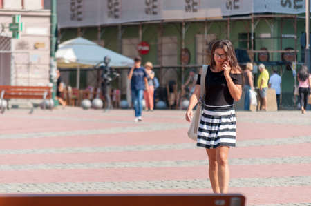 TIMISOARA, ROMANIA - SEPTEMBER 09, 2016: Woman walking on the street. Real people.のeditorial素材