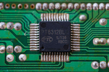 TIMISOARA, ROMANIA - DECEMBER 15, 2019: Close-up of a PTC PT6312BLQ LCD Driver. Electronic componentsのeditorial素材