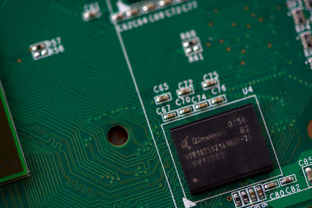 TIMISOARA, ROMANIA - DECEMBER 22, 2019: Close-up of a Qimonda HYB18TS12161B2F-25 memory integrated circuit. Electronic componentsのeditorial素材