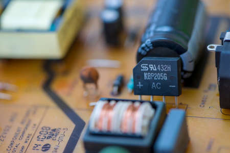 TIMISOARA, ROMANIA - NOVEMBER 10, 2019: Close-up of a TSC KBP205G glass passivated bridge rectifier. Electronic componentsのeditorial素材