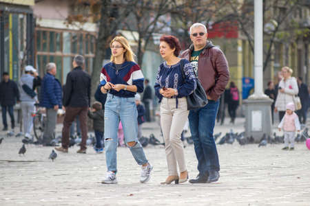 TIMISOARA, ROMANIA - NOVEMBER 17, 2019: People walking on the street. Real people.のeditorial素材