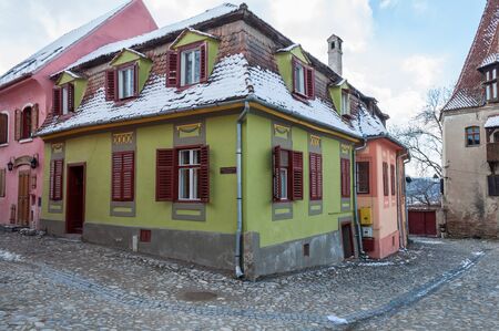 Old houses and road made of cubic stone. View of an historic city.の写真素材