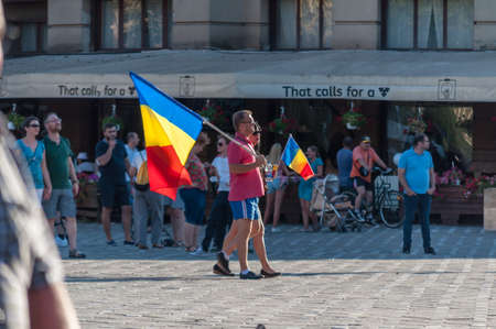 TIMISOARA, ROMANIA - AUGUST 10, 2018:  Man and woman with the romanian flag at the anti-government protestのeditorial素材