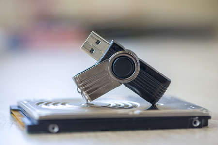 TIMISOARA, ROMANIA - SEPTEMBER 15, 2019: Close-up of a KINGSTON pen drive, flash disk sitting on a disk driveのeditorial素材