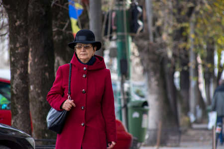 TIMISOARA, ROMANIA - NOVEMBER 17, 2019: Woman walking on the street. Real people.のeditorial素材
