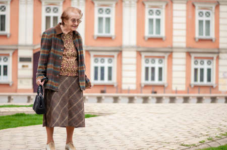 Timisoara, Romania - April 09, 2016: Woman walking on the street. Real people.のeditorial素材