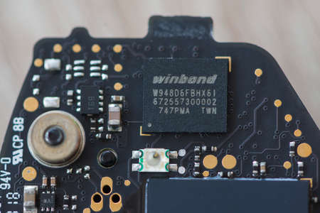 TIMISOARA, ROMANIA - NOVEMBER 10, 2019: Close-up of a Winbond W948D6FBHX6I memory. Electronic components.のeditorial素材