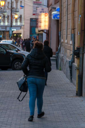TIMISOARA, ROMANIA - OCTOBER 04, 2018: Woman walking on the street. Real people.のeditorial素材