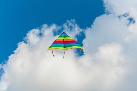Kite flying in the sky. Couds in the background.の写真素材