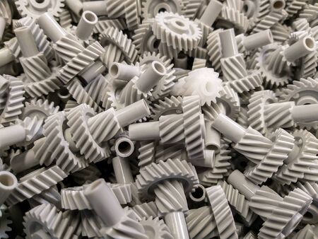 Background with cogwheels made of plasticの写真素材