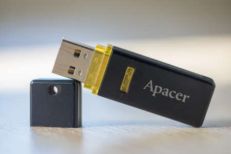 TIMISOARA, ROMANIA - JUNE 24, 2019: Close-up of a APACER pen drive, flash disk sitting on a disk...