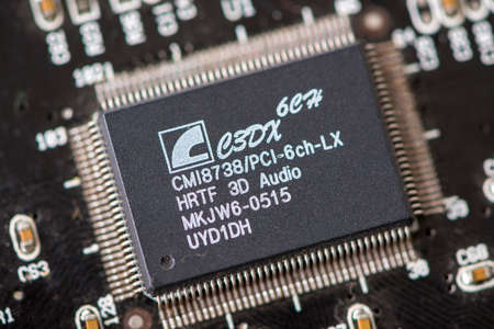 TIMISOARA, ROMANIA - DECEMBER 29, 2019: Close-up of a C-Media CMI8738 3D audio chip. Electronic...