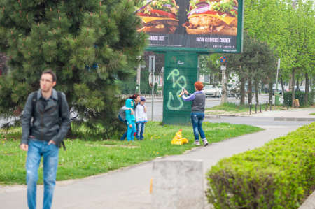 Timisoara, Romania - April 09, 2016: People taking a selfie on the street. Real people.のeditorial素材