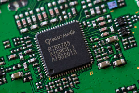 Timisoara, Romania - April 05, 2020: Close-up of a Qualcomm RTR6285 UMTS/EGPRS transceiver....