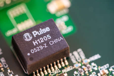 Timisoara, Romania - April 30, 2020: Close-up of a Pulse H1205 electronic component