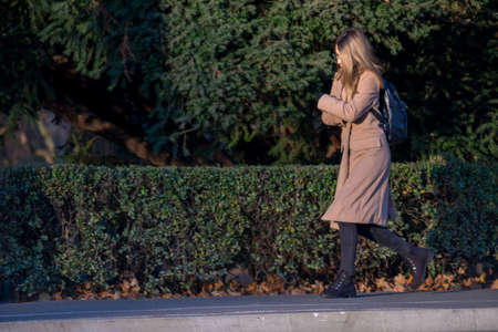 TIMISOARA, ROMANIA - NOVEMBER 17, 2019: Woman walking on the street. Real people.のeditorial素材