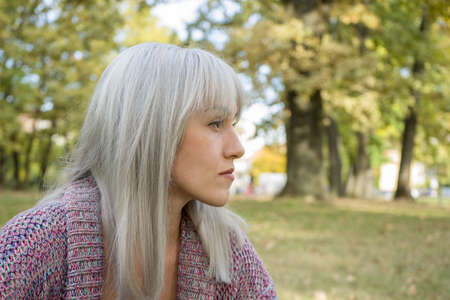 Outdoors portrait of a woman. Profile view. Silver hair.の写真素材