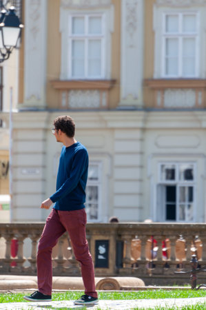 Timisoara, Romania - September 02, 2013: Man walking on the street. Real people.のeditorial素材