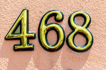 House number plate 468 on a wall. Street number. Address number.の写真素材