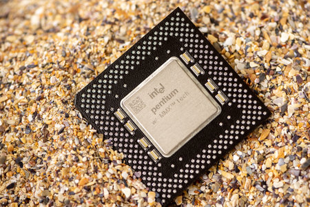 Timisoara, Romania - October 17, 2020: Close-up of an Intel MMX FV80503166 processor, 166 MHz, socket 7 with sand in the background.のeditorial素材