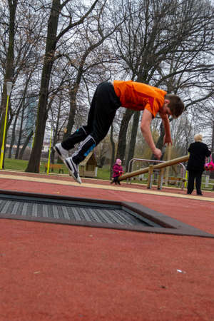 Timisoara, Romania - February 16, 2013: Kids jumping on a trampoline in a park. Real people.