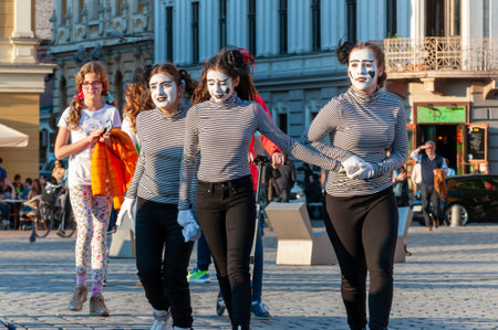 Timisoara, Romania - March 31, 2017: Girls in mime costume walking on the street at the CheckArt Carnavalのeditorial素材
