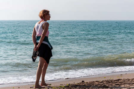 2 Mai, Romania - July 13, 2017: People walking on the beach. Real people.のeditorial素材