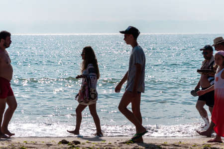 2 Mai, Romania - July 13, 2017: People walking on the beach. Real people.のeditorial素材