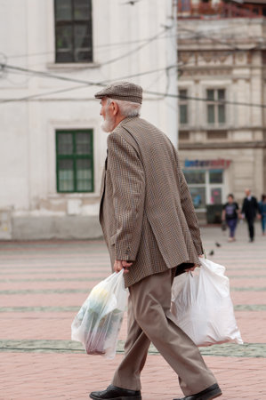 Timisoara, Romania - May 07, 2015: Man walking on the street. Real people.のeditorial素材