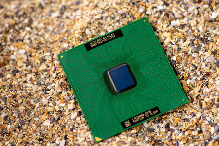 Timisoara, Romania - October 17, 2020: Close-up of an Intel Pentium III SL52R processor, 1 GHz, socket 370 with sand in the background.のeditorial素材