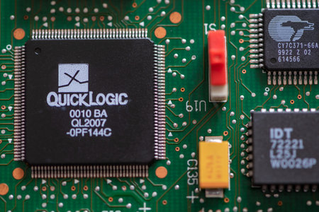 Timisoara, Romania - August 24, 2019: Close-up on a QuickLogic QL2007-0PF144C FPGA pASIC. Electronic...
