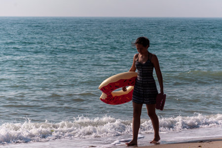 2 Mai, Romania - July 13, 2017: People walking on the beach. Real people.のeditorial素材