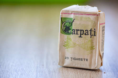 Timisoara, Romania - February 22, 2020: Carpati, an old pack of cigarettes on a wooden tableのeditorial素材