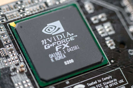 Timisoara, Romania - March 30, 2020: Close-up of a nVIDIA GeForce FX 5200 graphics processor. Electronic componentsのeditorial素材