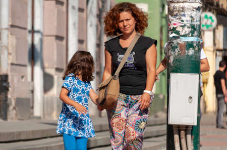 Timisoara, Romania - May 05, 2016: Mother and daughter walking on the street. Real people.のeditorial素材