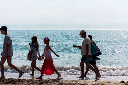 2 Mai, Romania - July 13, 2017: People walking on the beach. Real people.のeditorial素材
