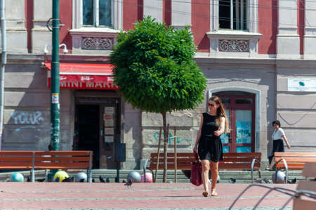 Timisoara, Romania - June 27, 2017: Woman walking on the street. Real people.のeditorial素材