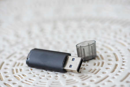 Close-up of a flash drive sitting on a tableの写真素材