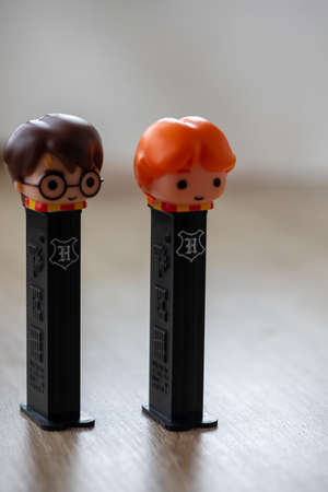 Timisoara, Romania - January 23, 2021: Close-up of a PEZ dispenser on a wooden table. Harry potter charactersのeditorial素材