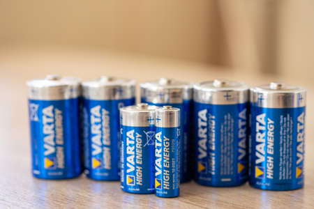Timisoara, Romania - March 06, 2021: Close-up of Varta batteries on a wooden tableのeditorial素材