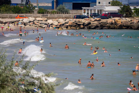 2 Mai, Romania - August 07, 2020: People swimming in the beachのeditorial素材