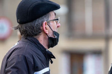 Timisoara, Romania - December 21, 2021: Portrait of a man walking on the street. Real people.のeditorial素材