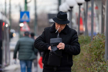 Timisoara, Romania - December 21, 2021: Man walking on the street. Real people.のeditorial素材