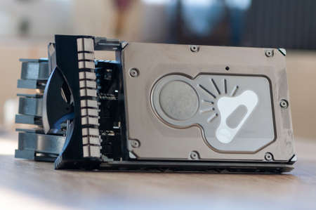 Close-up of a 2.5'' HDD server caddy tray stacked on each other on a tableの写真素材