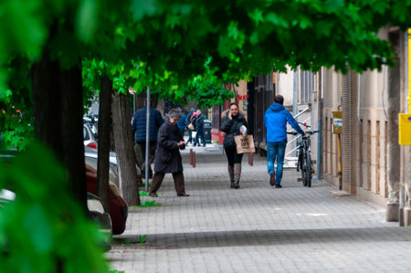 Timisoara, Romania - April 20, 2017: People walking on the street. Real people.のeditorial素材